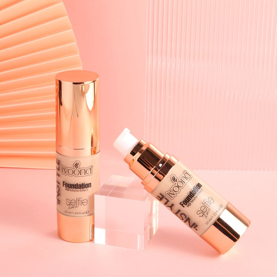 Two IVOONA Selfie Time HD Matte Effect foundation pumps standing on product box against peach backdrop