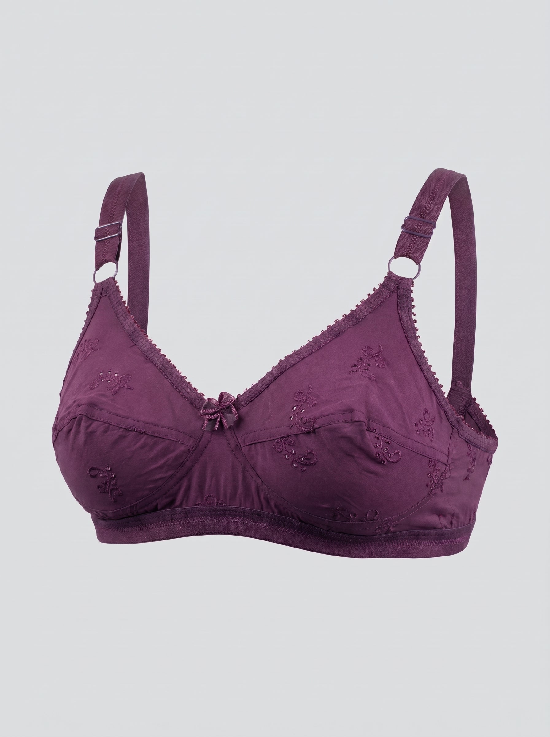 A dark purple underwire bra with embroidered floral details, scalloped edges, and adjustable shoulder straps, shown against a light gray background. #color_wine