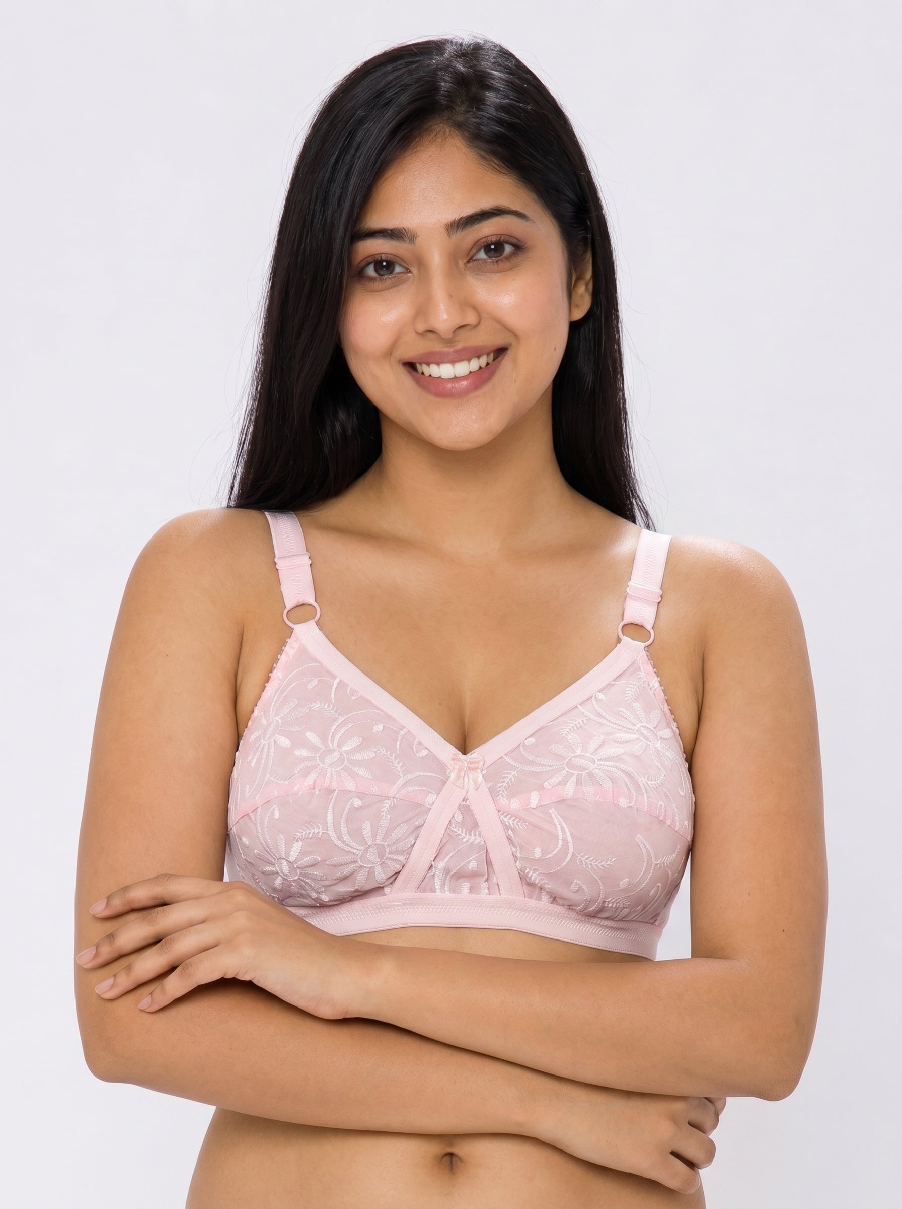 Woman wearing a pink bra against a white background #color_pink