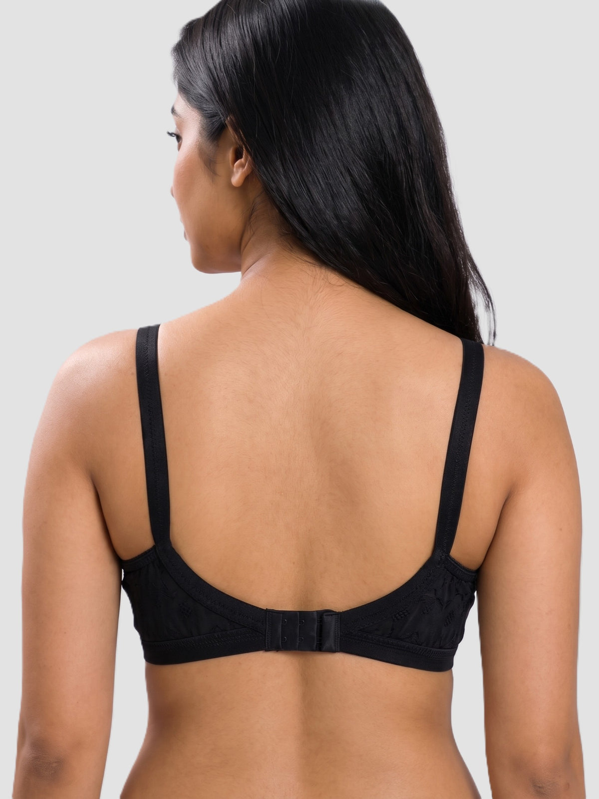 Like-Me Sonu Bra in black with adjustable straps and hook-and-eye back closure, back view on model. #color_black