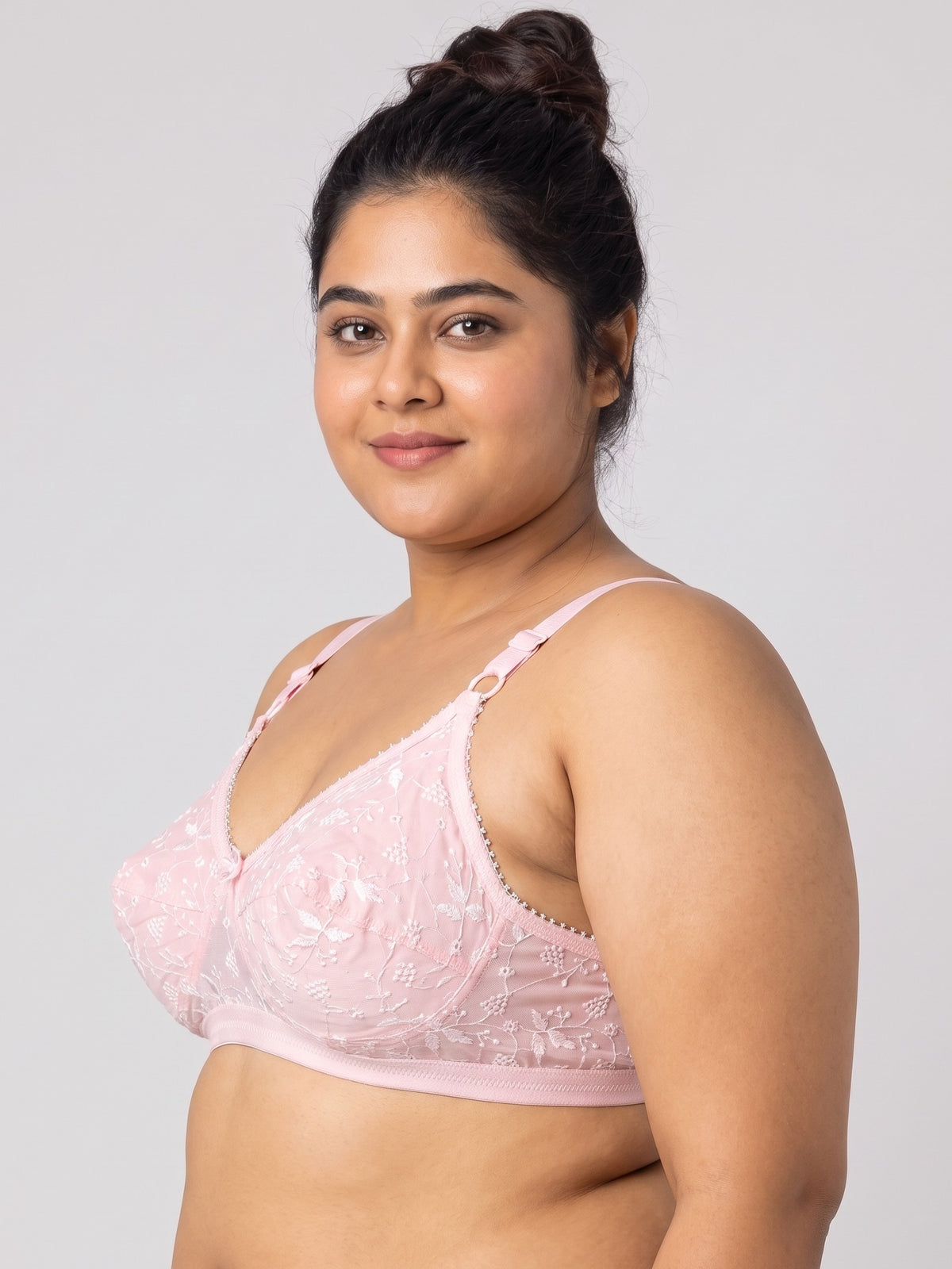 Like-Me Sonu Bra in pink with floral lace cups and adjustable straps, side view on plus-size model. #color_pink