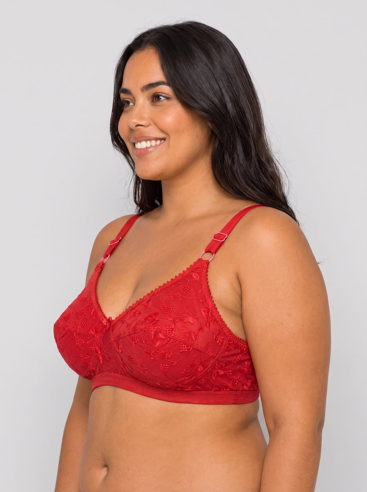 Like-Me Sonu Bra in red with floral lace cups and adjustable straps, side view on plus-size model. #color_red