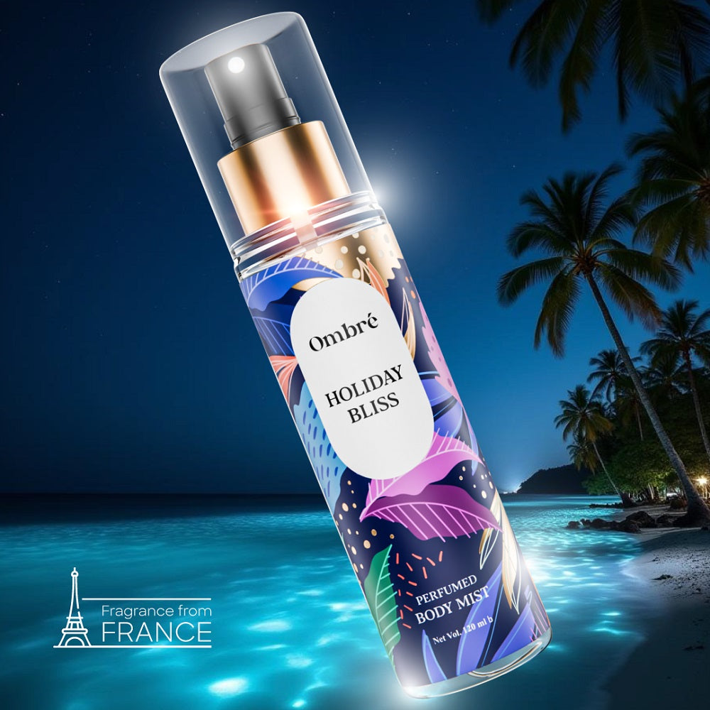 Ombré Holiday Bliss Perfumed Body Mist displayed over a tropical beach night background with palm trees – fragrance made in France.