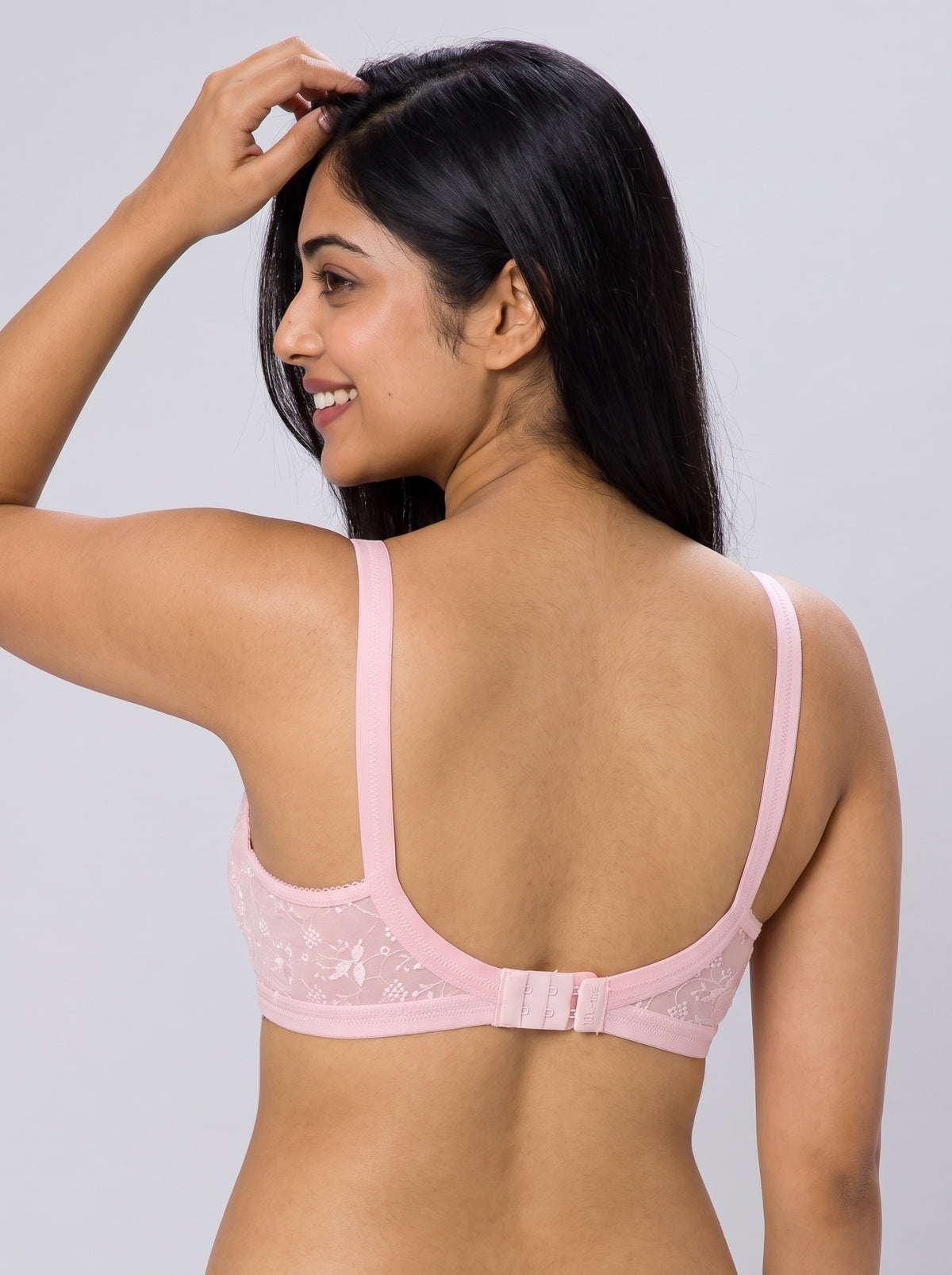 Like-Me Sonu Bra in pink with adjustable straps and hook-and-eye back closure, back view on model. #color_pink