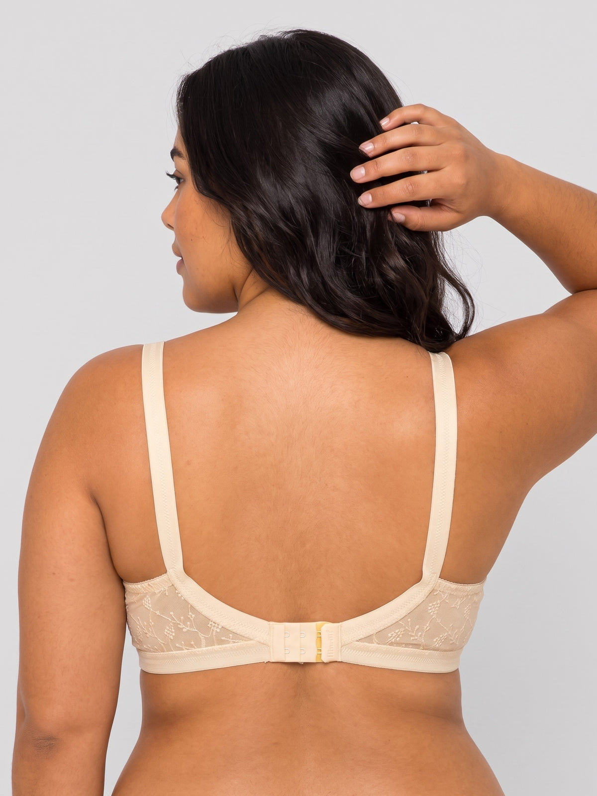 Like-Me Sonu Bra in skin color with adjustable straps and hook-and-eye back closure, back view on plus-size model. #color_skin