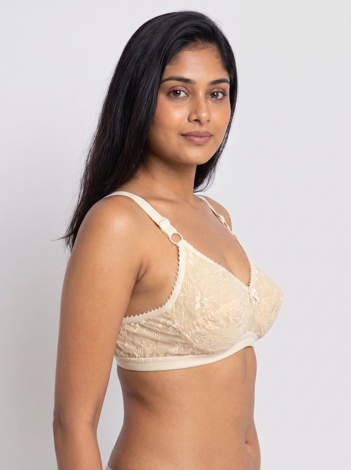 Like-Me Sonu Bra in skin color with floral lace cups and adjustable straps, side view on model. #color_skin